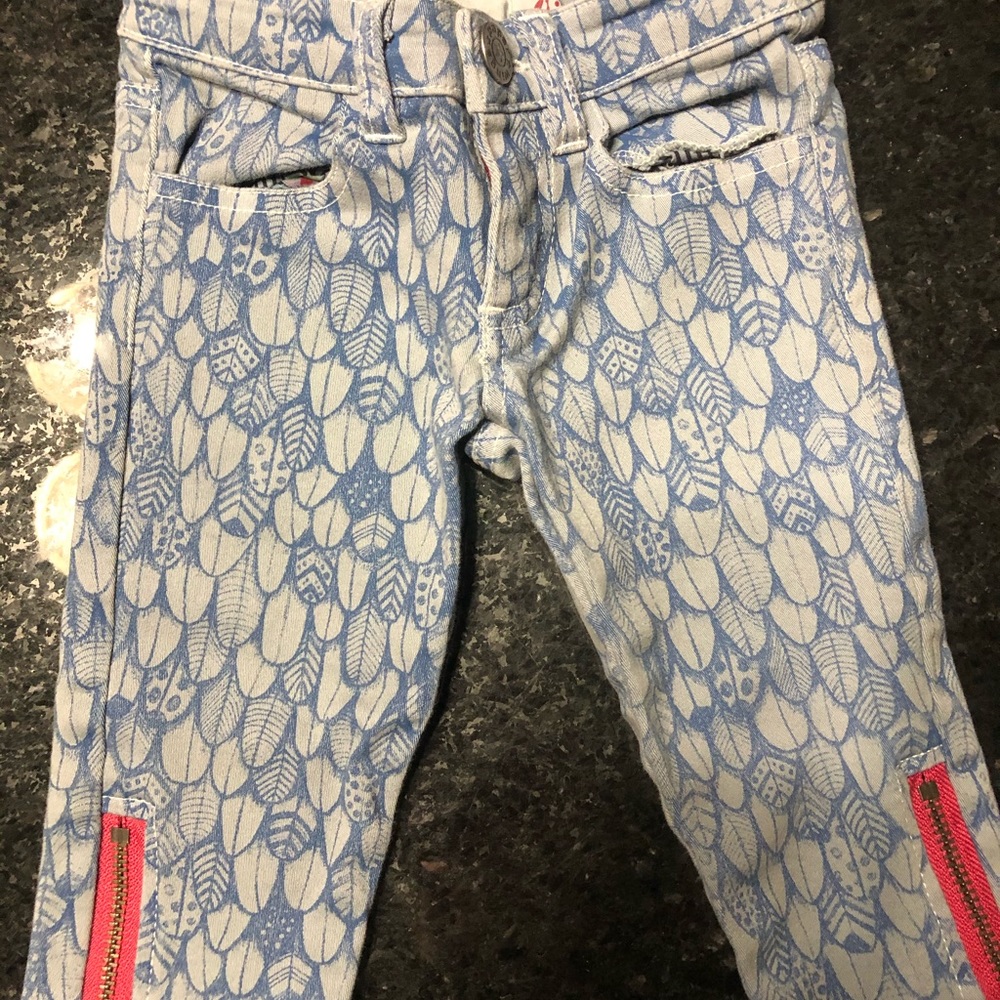 Paper Wings feather print jeans